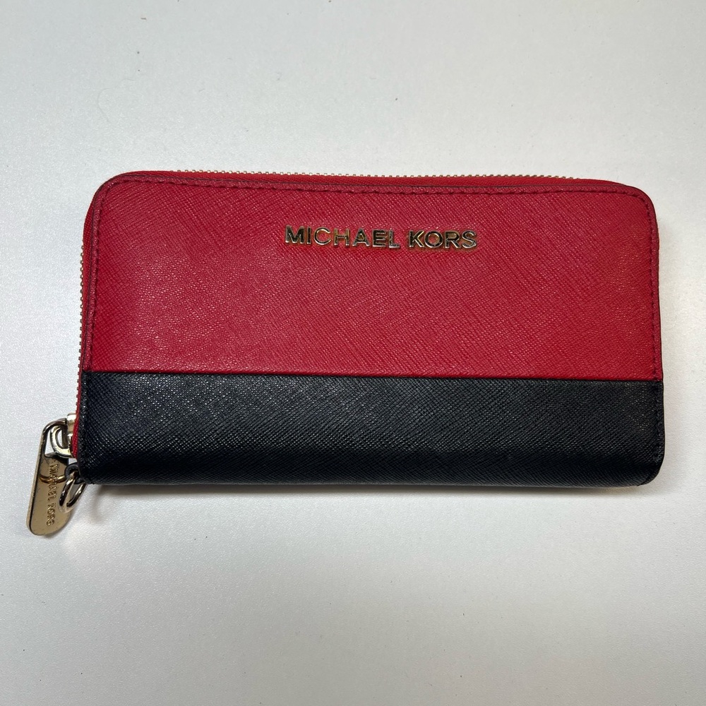 Black and red Michael Kors zipper around Wallet used